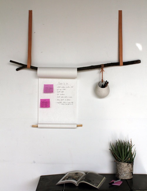Use an old tree branch and a vintage belt to make this minimalist display for notes and pens.
