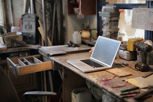 Laptop on the table in a workshop