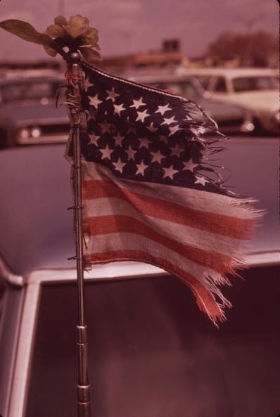american flag on car antenna