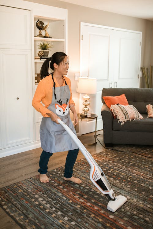 a-lady-using-a-powerful-wet-dry-vacuum-cleaner