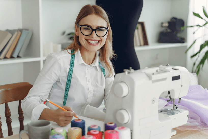 dressmaker-in-front-of-her-sewing-machine-smiling